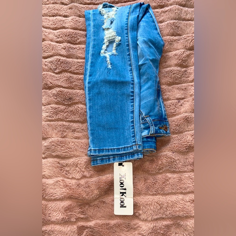 NWT high waisted distressed jeans.